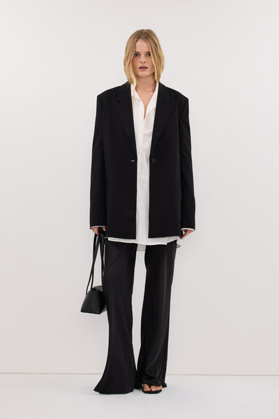Zoe wearing KEATON BLACK SLIM LONGLINE BLAZER
