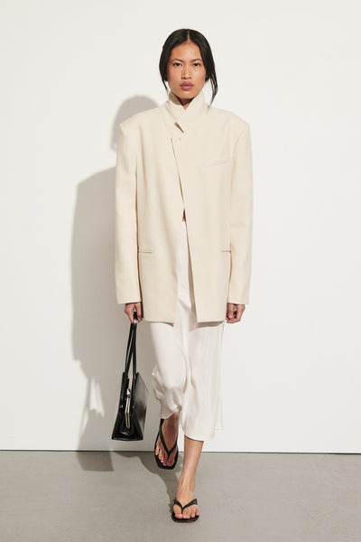 Ploy wearing TRINITY BONE STAND COLLAR BLAZER