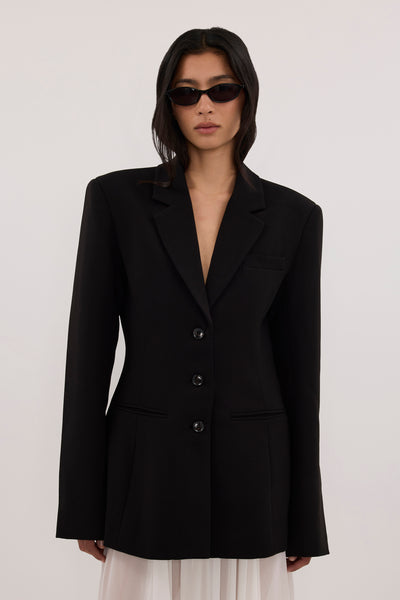 Zoey wearing CHIARA BLACK CINCHED BLAZER