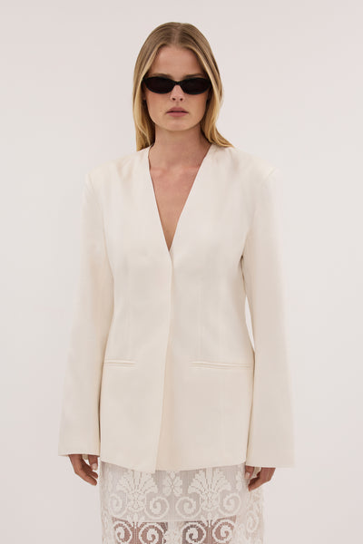 Zoe wearing GIULIA IVORY COLLARLESS BLAZER