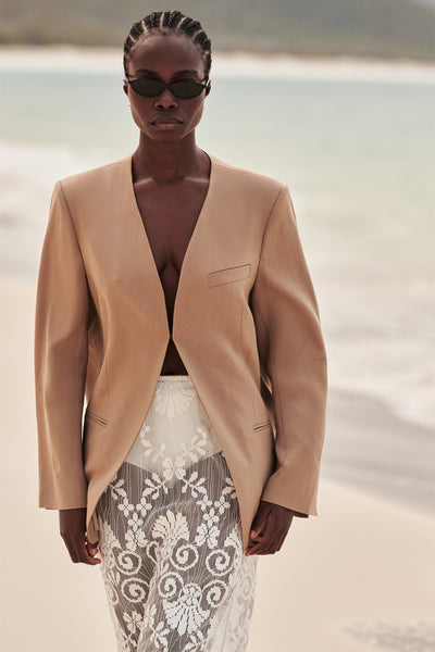 Cynthia wearing HALINA WHEAT COLLARLESS BLAZER