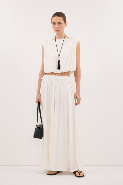 Stas wearing AVA OFF WHITE SLEEVELESS MODAL BLEND TOP