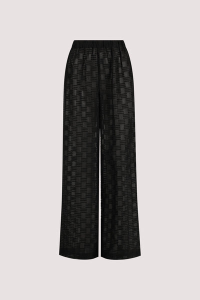 Stas wearing ELBA BLACK SHEER CHECK PANTS