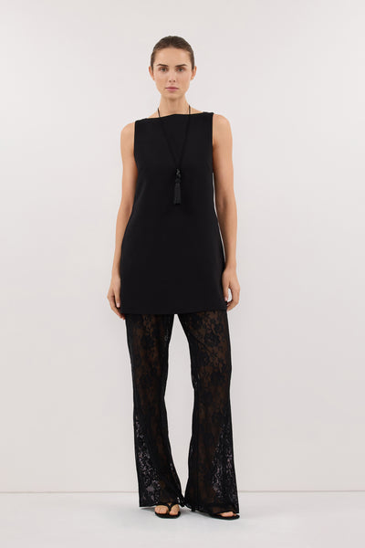 Stas wearing ROWIE BLACK SLEEVELESS BOAT NECK TUNIC TOP