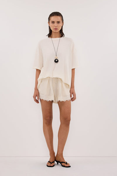 Stas wearing SLOANE CREAM COTTON LONGLINE TEE