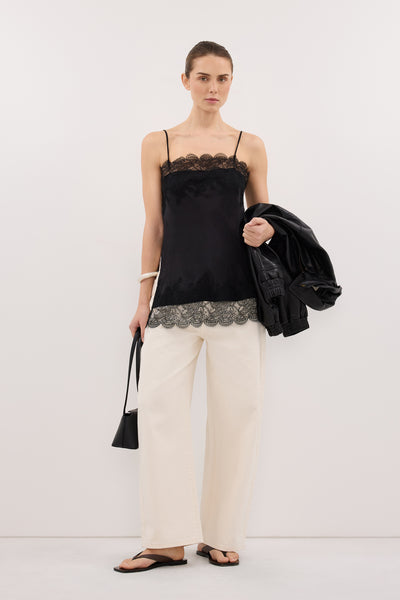 Kristen wearing MINA BLACK CUPRO LACE TOP