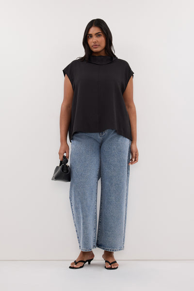 Zoe wearing CALIA BLACK FUNNEL NECK TOP