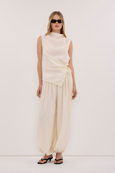 Zoe wearing CALIA CREAM TIE TOP
