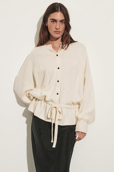 Sofia wearing SAILOR IVORY BELTED CARDIGAN