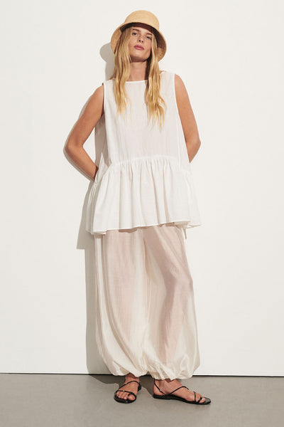 Zoe wearing SAMMY WHITE COTTON DROP WAIST TOP