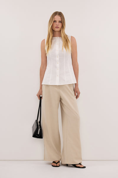 Zoe wearing SCOTTIE WHITE SLEEVELESS COTTON TOP