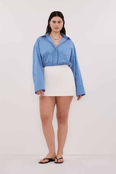 Jasmine wearing SOHO WHITE TAILORED SKORT