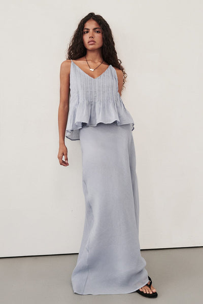 Keilani wearing MAISON DUSTY BLUE RAMIE BIAS MAXI SKIRT