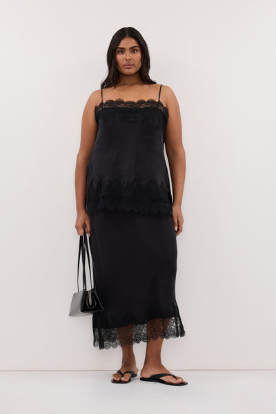 Shanaya wearing MINA BLACK CUPRO LACE MIDI SKIRT
