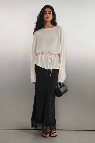 Anaya  wearing MINA BLACK CUPRO LACE MIDI SKIRT