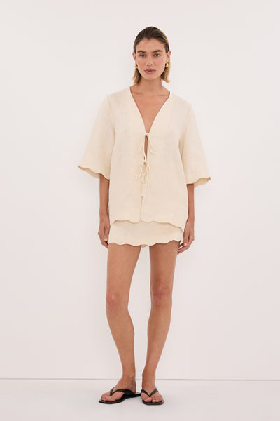 Joanna wearing LELA SANDSTONE LINEN SKORT