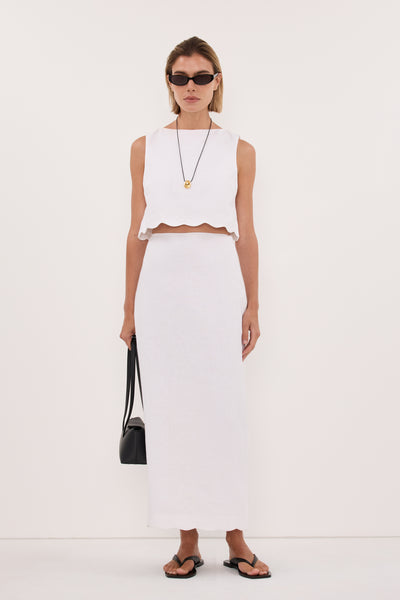 Joanna wearing LELA WHITE LINEN MIDI SKIRT