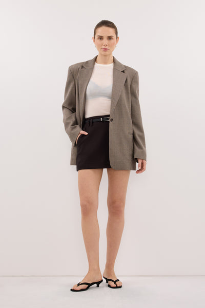 Stas wearing MONIQUE PEAT CHOC TAILORED SKORT
