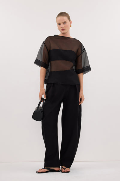Zoe wearing ROMY BLACK BARREL LEG TAILORED PANT