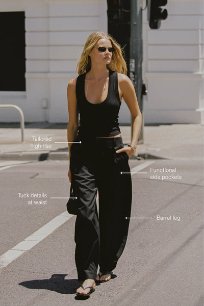 Zoe wearing ROMY BLACK BARREL LEG TAILORED PANT