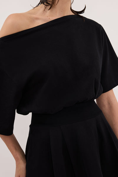 Annie wearing ESME BLACK ASYM MINI DRESS
