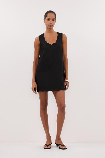 Kristen wearing LELA BLACK SLEEVELESS LINEN MINI DRESS