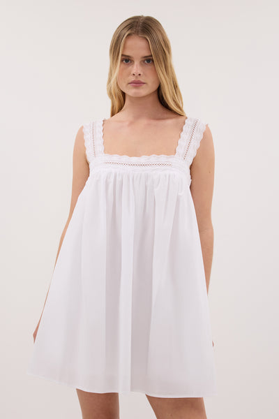 Zoe wearing MIRANDA WHITE LACE TRIM MINI DRESS
