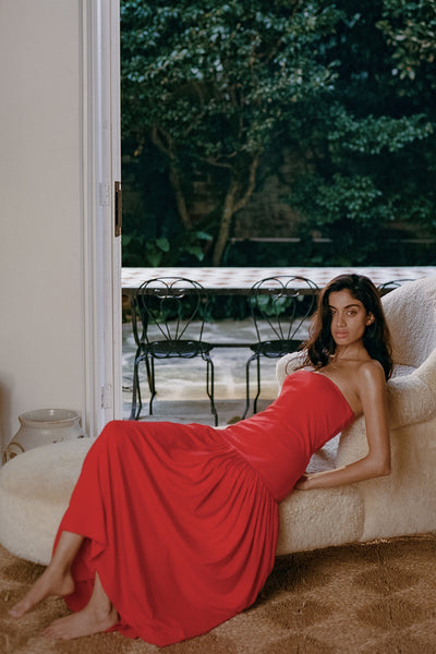 Anaya wearing AVEN RED BANDEAU MAXI DRESS - PRE ORDER