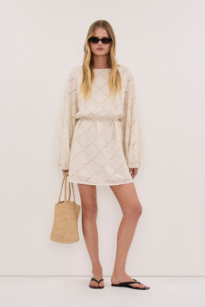 Zoe wearing ANNIKA CREAM COTTON MINI DRESS