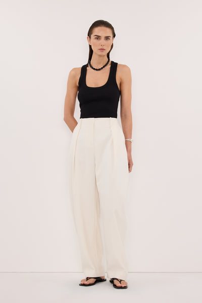 Stas wearing CLARA BLACK SCOOP NECK TANK TOP