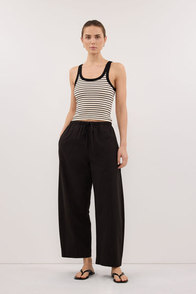 Stas wearing PENNY CREAM SLEEVELESS STRIPE KNIT TANK TOP