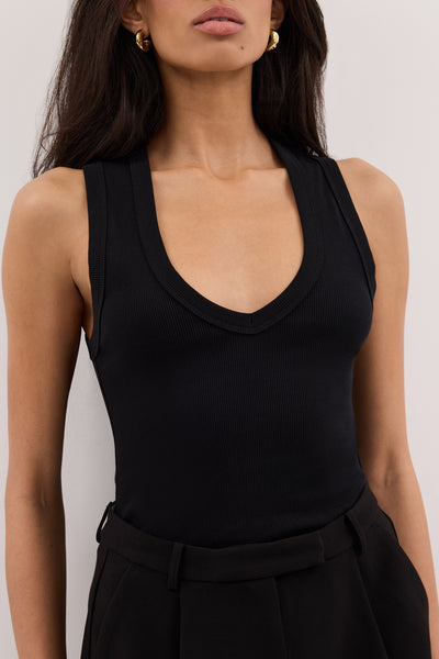Zoe wearing YASMIN BLACK SLEEVELESS KNIT TANK
