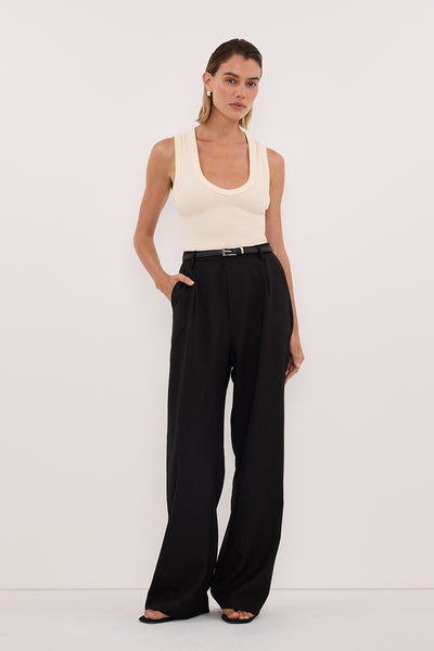 Joanna wearing YASMIN SANDSTONE SLEEVELESS KNIT TANK