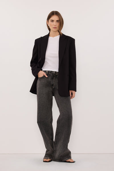 Stas wearing REAGAN 2.0 WASHED BLACK TALL SLOUCHY JEAN
