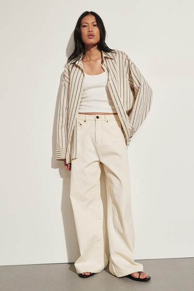 Ploy wearing DREW CREAM WIDE LEG DENIM JEAN