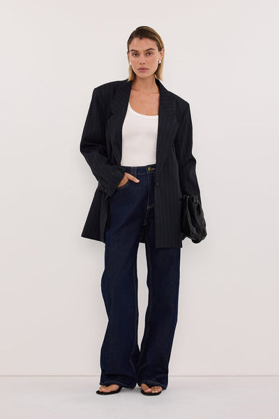 Joanna wearing REAGAN 2.0 INDIGO SLOUCHY JEAN
