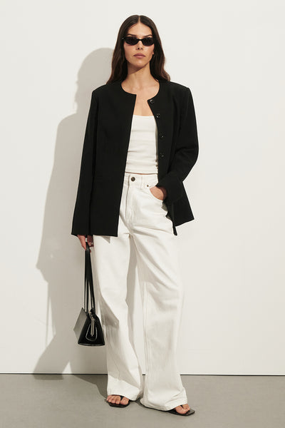 Helena  wearing REAGAN 2.0 WHITE SLOUCHY JEAN
