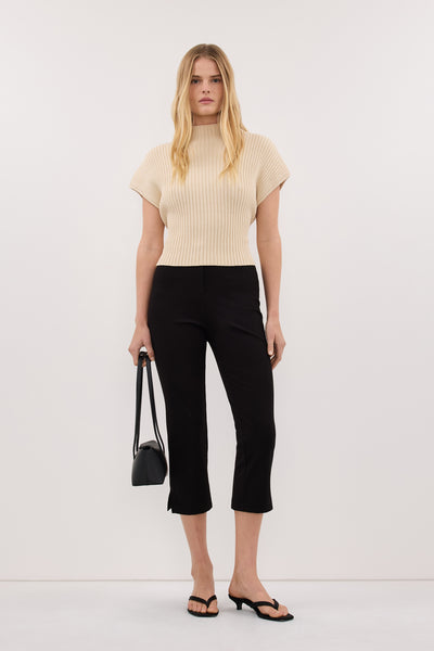 Zoe wearing DELLA NATURAL KNIT TOP