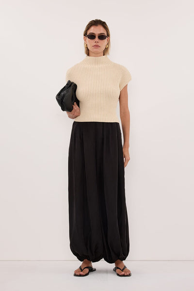 Joanna wearing DELLA NATURAL KNIT TOP
