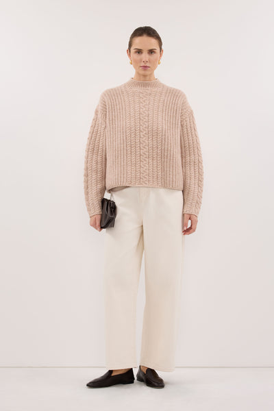 Stas wearing JOLIE OAT CABLE KNIT SWEATER
