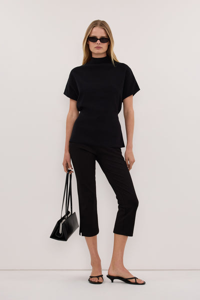 Zoe wearing DIANA BLACK FUNNEL NECK TOP
