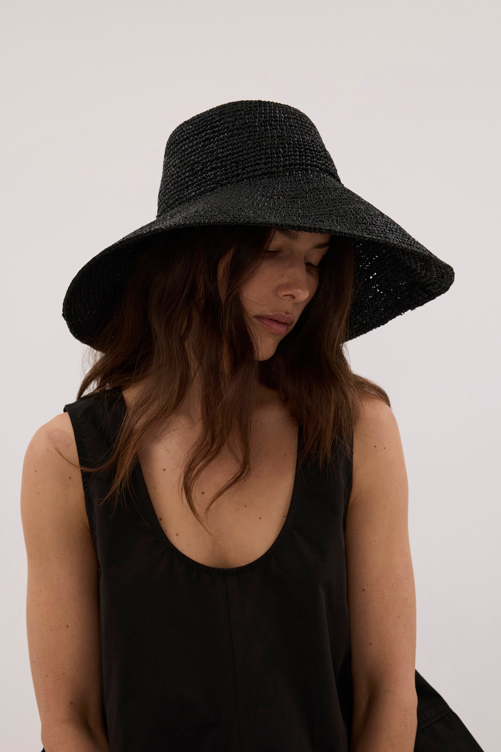 OCHRE LANE BLACK RAFFIA BUCKET HAT
