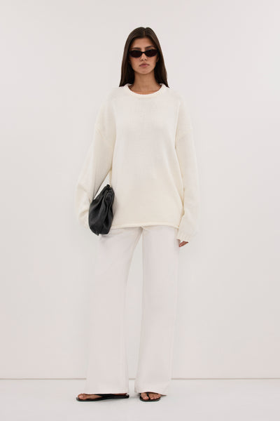 Aida wearing BRYANNA IVORY LONGLINE KNIT JUMPER