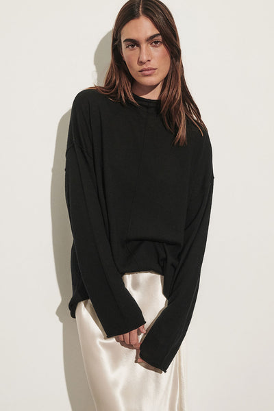 Sofia wearing VIRELLE BLACK MERINO KNIT TOP