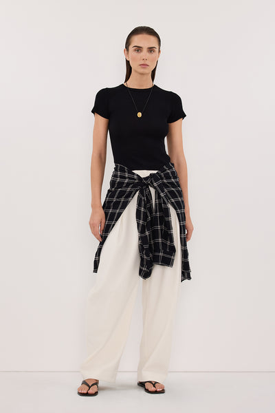Stas wearing CLO BLACK RIBBED BABY TEE