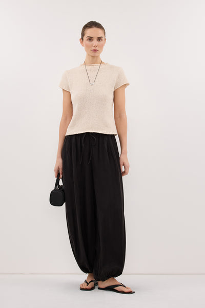 Stas wearing LEO SANDSTONE KNIT TOP