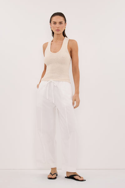 Stas wearing ASPEN SANDSTONE SLEEVELESS RACER KNIT TOP