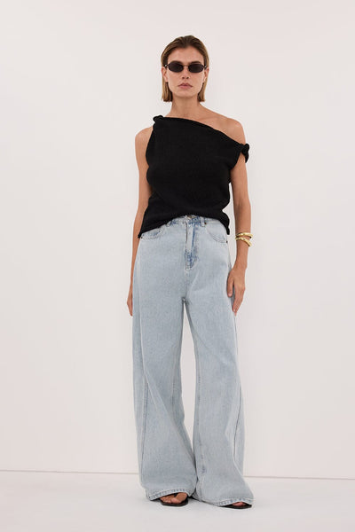 Joanna wearing KARA BLACK ASYM KNIT TOP