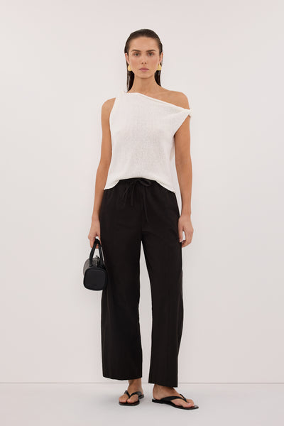 Stas wearing KARA OFF WHITE ASYM KNIT TOP