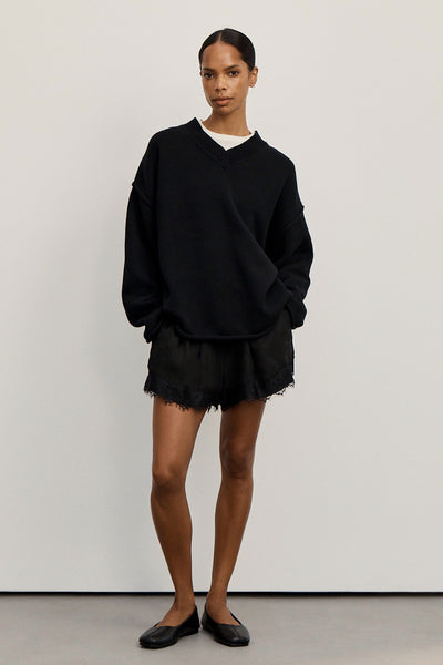 Kristen wearing FLINT BLACK V NECK KNIT JUMPER